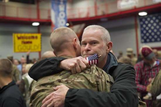 Father embracing son after a yer apart in Ft. Campbell, Kentucky