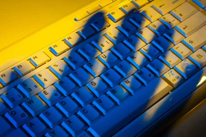 Keyboard and shadow. Data theft.